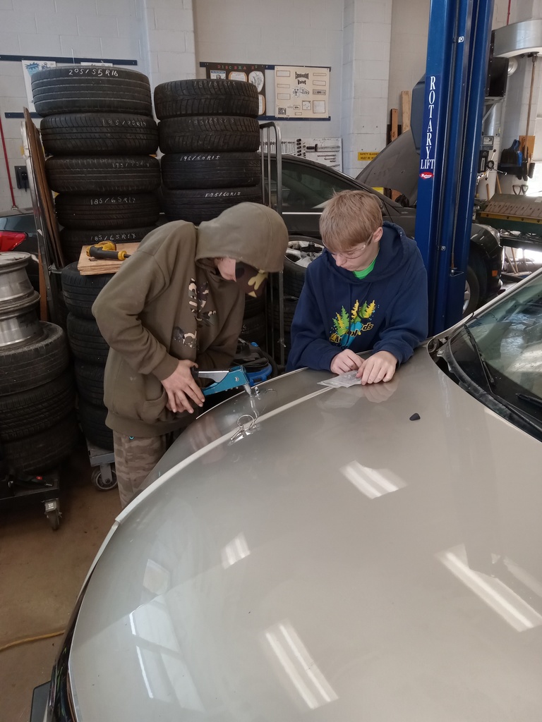 Installing the hood hold-down pins