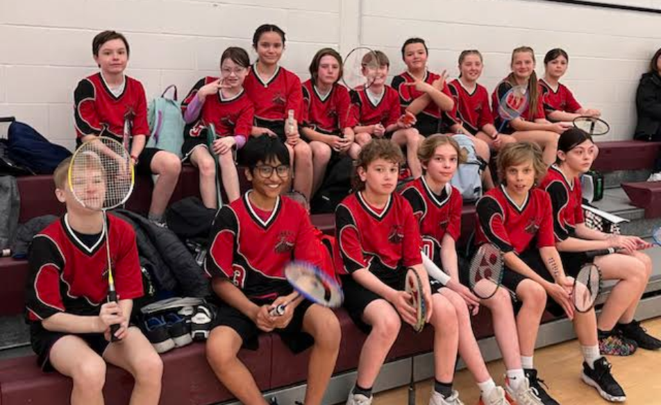 elementary students badminton sitting
